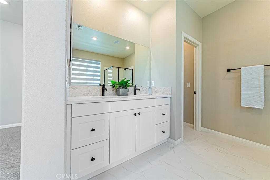 Custom double-sink vanity with designer cabinetry