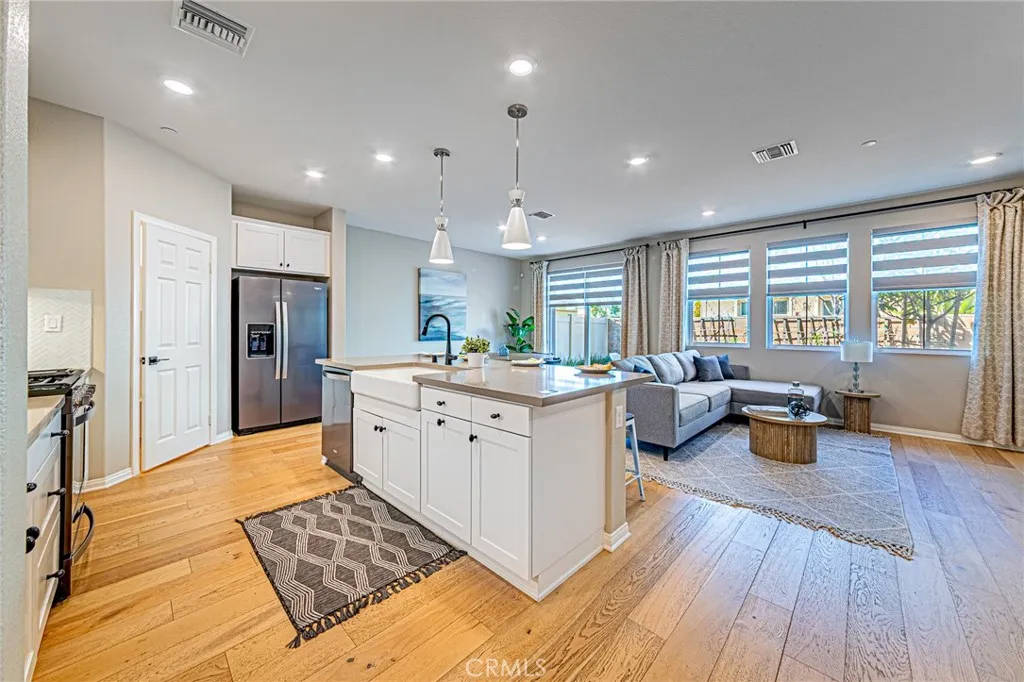 Open-concept floor plan featuring beautiful custom wood flooring
