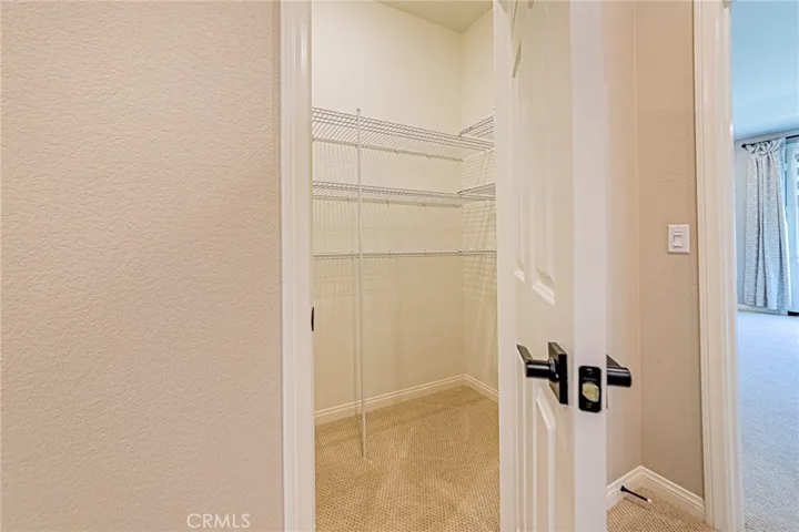 A convenient hallway linen/storage closet provides additional space for organization