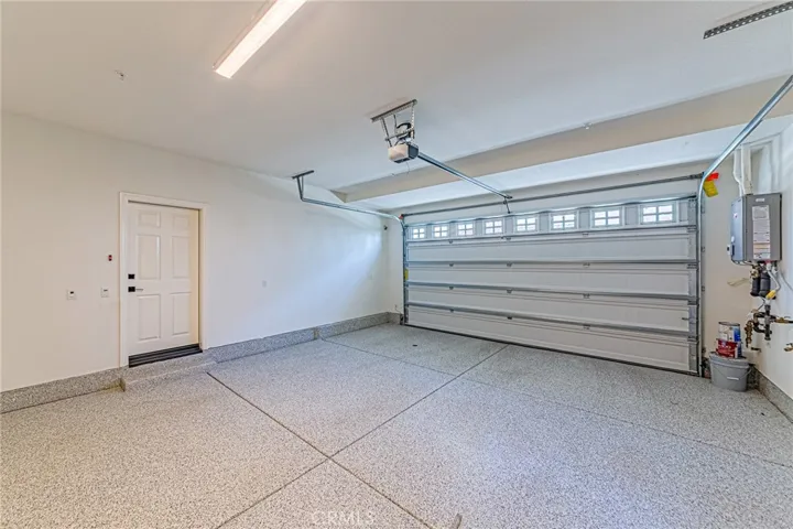 The garage features durable epoxy flooring