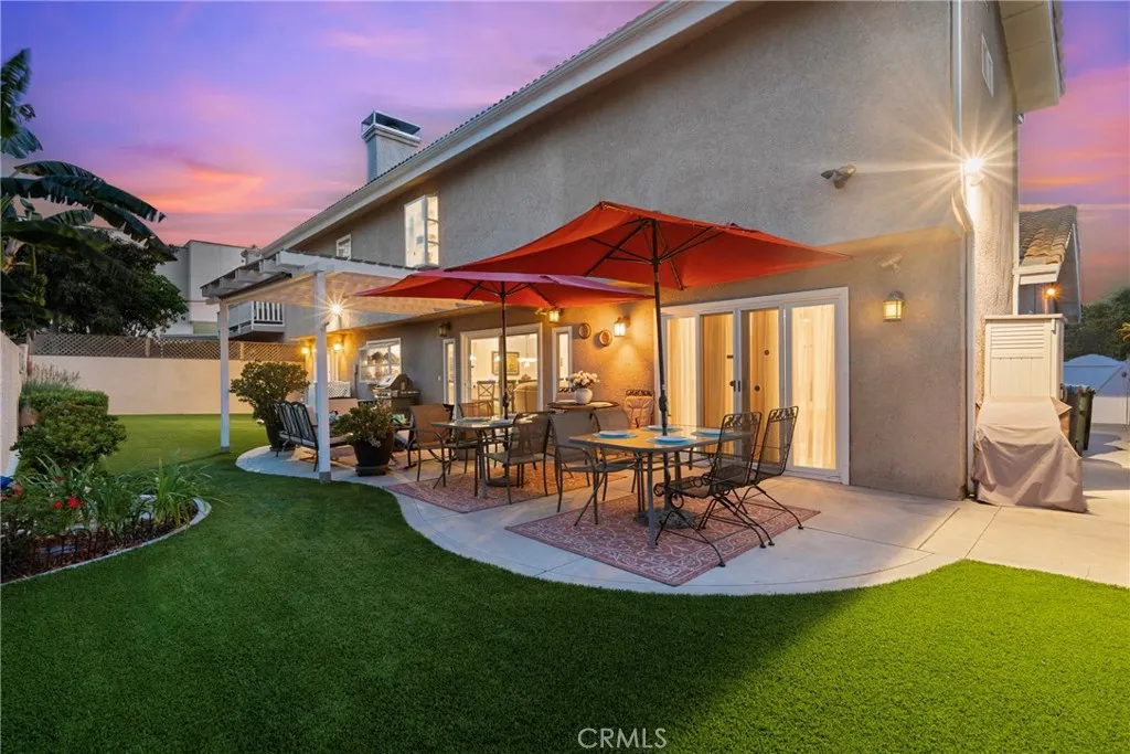 Spacious backyard with turf and patio