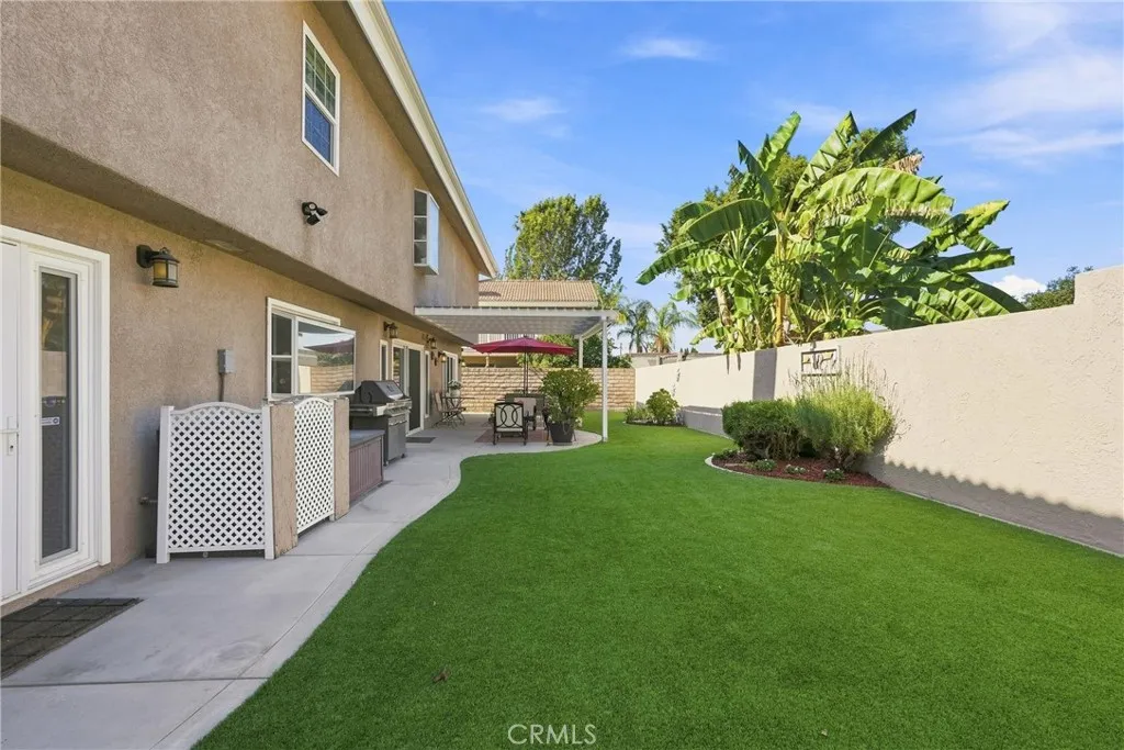 Spacious backyard with turf