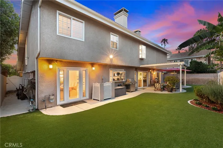 Spacious backyard with turf