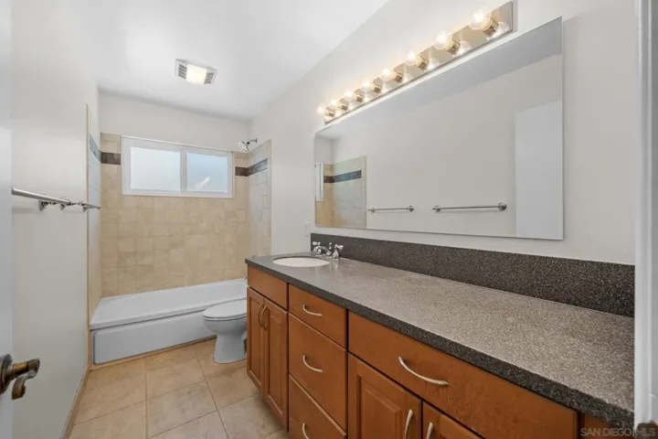 Hall bathroom has tub & shower. New mirror and lights