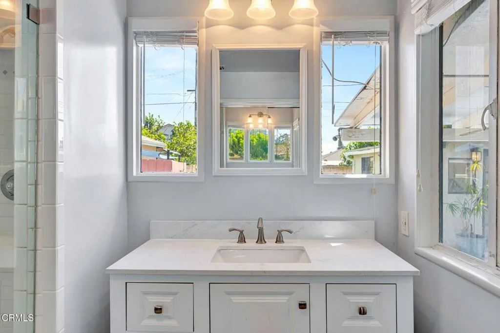 Primary bathroom with view to backyard Primary bathroom with view to backyard