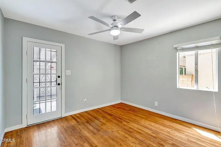 Bedroom #2 with entry to backyard