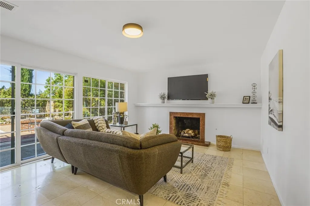 Great Room with Fireplace Open to Backyard