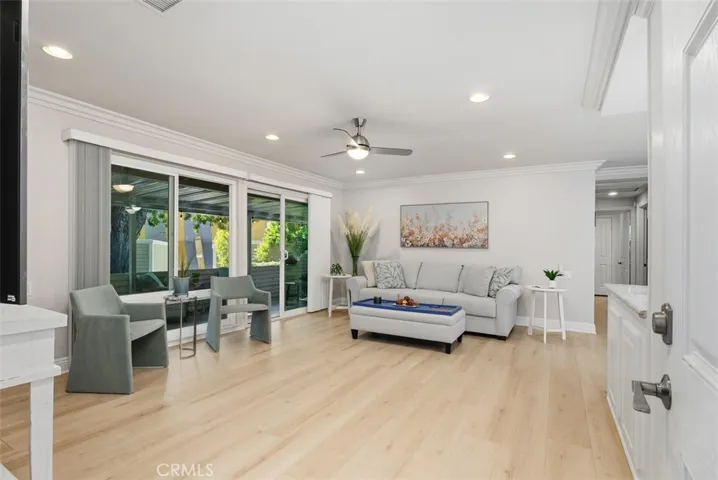 Living room with Luxury plank flooring overlooking the patio
