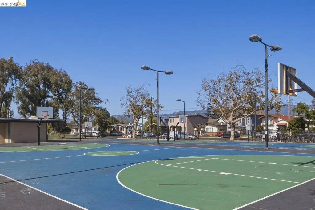 Multi-court sports area featuring blue and green surfacing