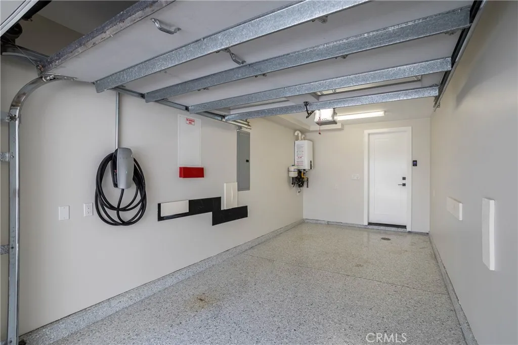 One-car garage with epoxy flooring and Tesla Charger