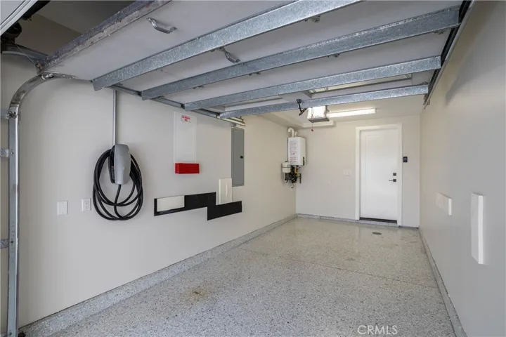 One-car garage with epoxy flooring and Tesla Charger