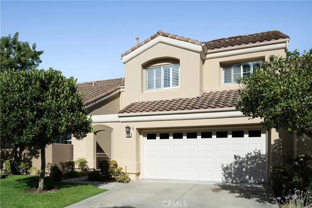 There is a two car attached garage with epoxy floor and driveway. There is a two car attached garage with epoxy floor and driveway.