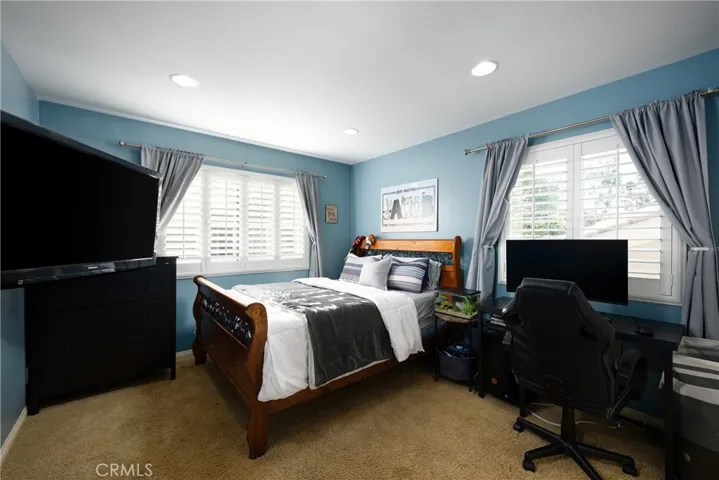 Guest bedroom located upstairs.