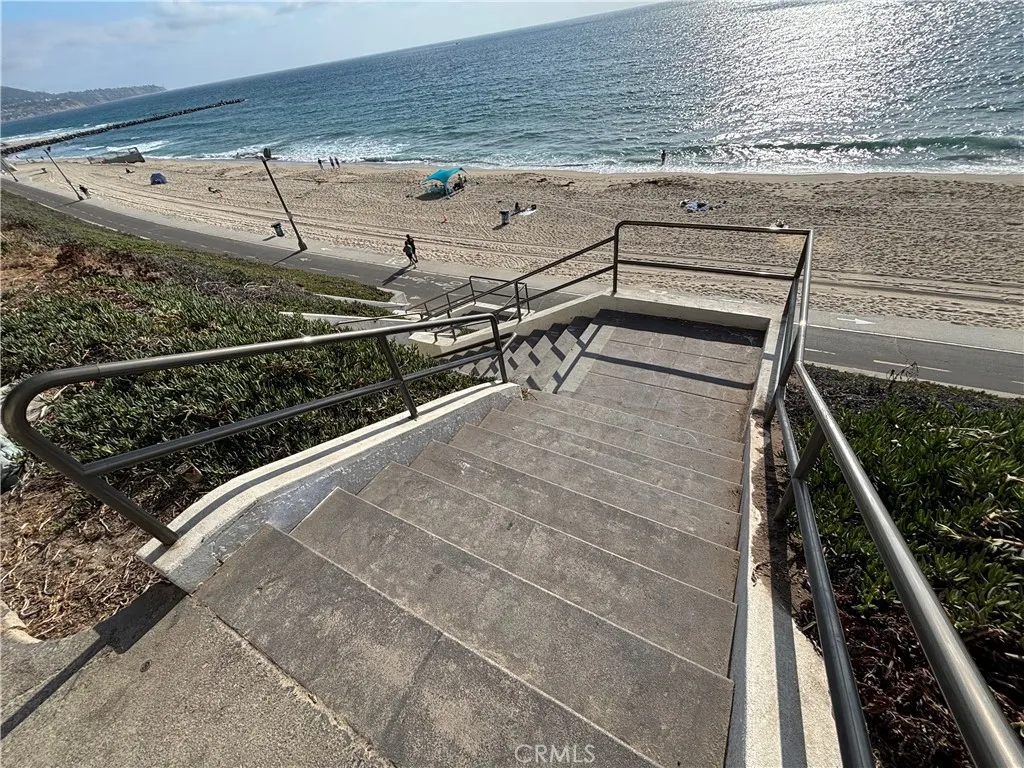 Steps from building to beach