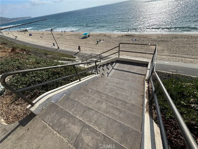 Steps from building to beach