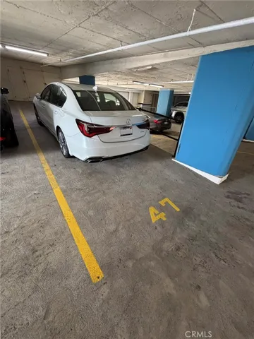 Garage tandem parking spaces 47 & 48 with 3 door garage storage in front of parking