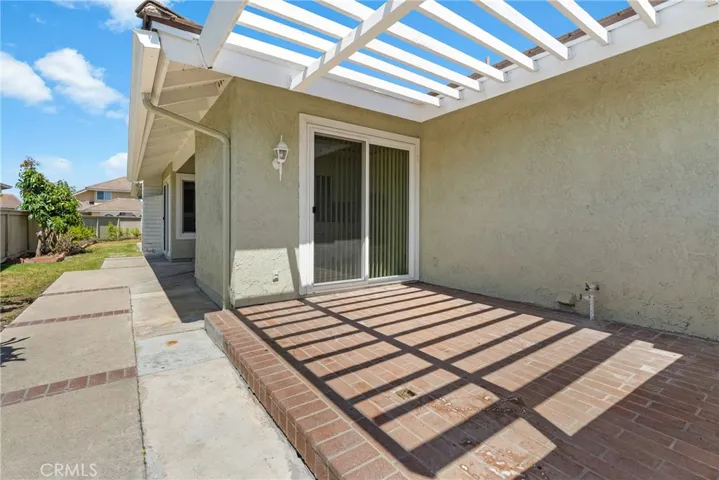 Side yard left-patio outside kitchen