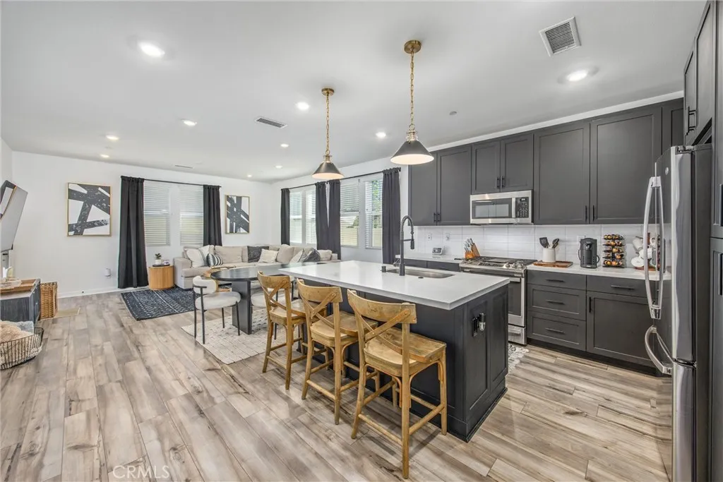 Open-concept kitchen with a large center island and seamless flow into the living area