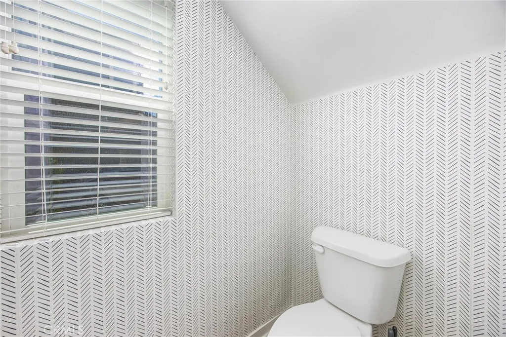 Convenient downstairs powder room offers easy access for guests