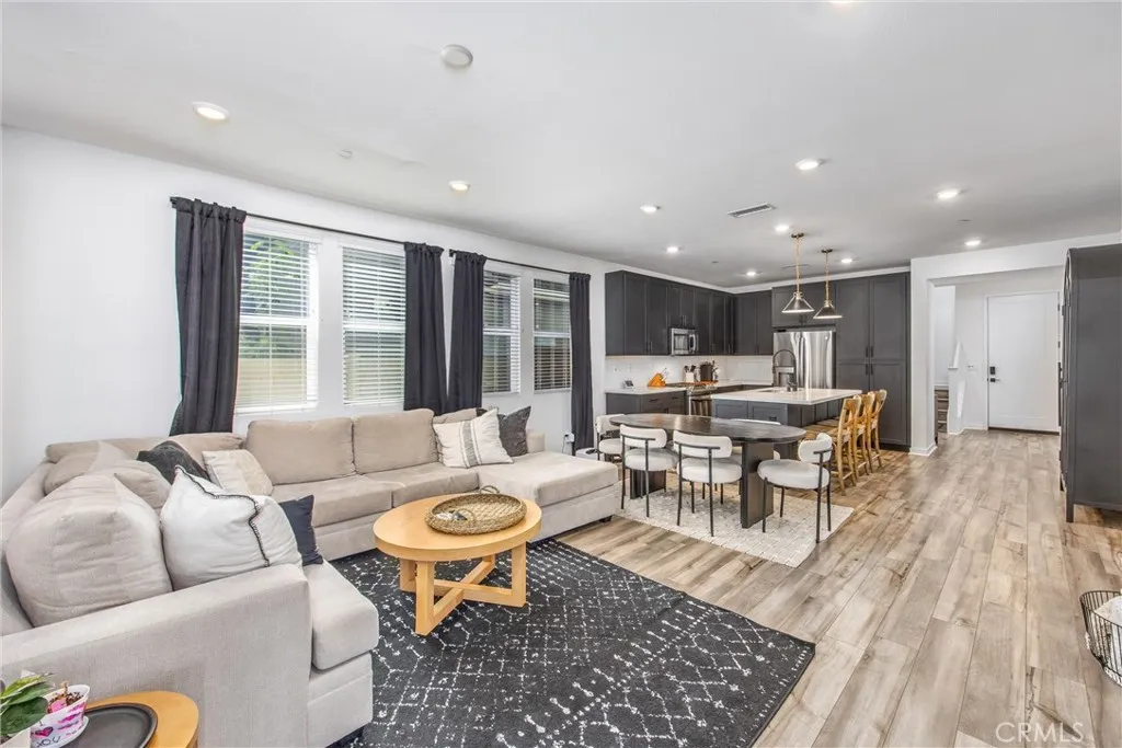 Open layout provides a seamless flow between the kitchen, dining, and living areas
