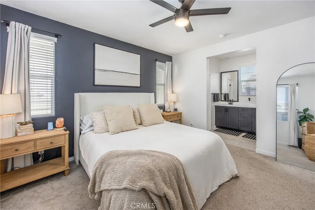 Spacious primary bedroom with convenient access to the en-suite bathroom