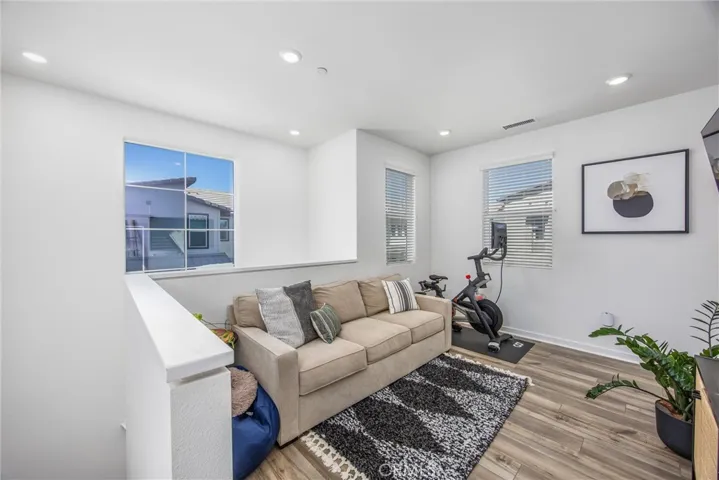 Versatile upstairs bonus area provides flexible space for a home office, lounge, or fitness area