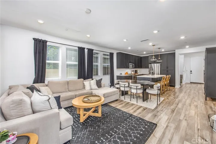 Open layout provides a seamless flow between the kitchen, dining, and living areas