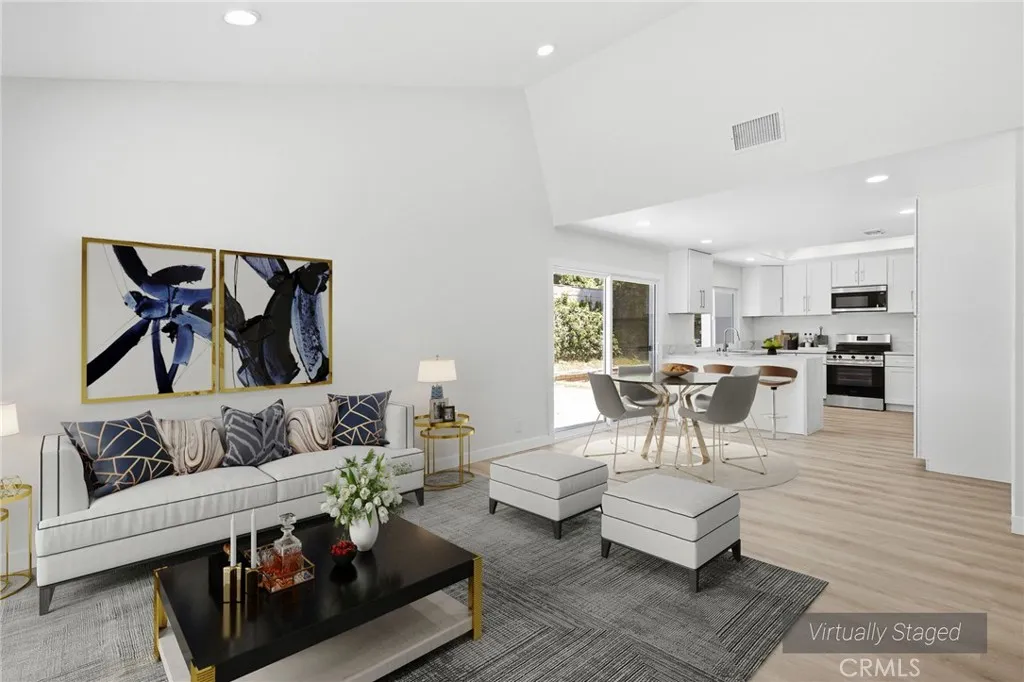 Virtually staged den and kitchen