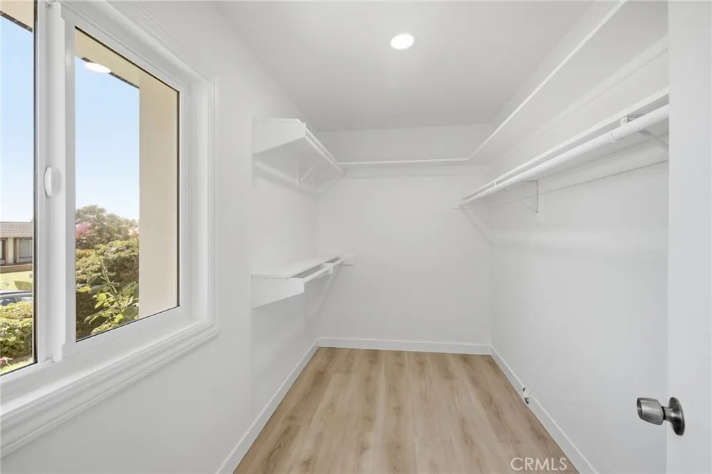 Walk-in closet in. Primary bedroom