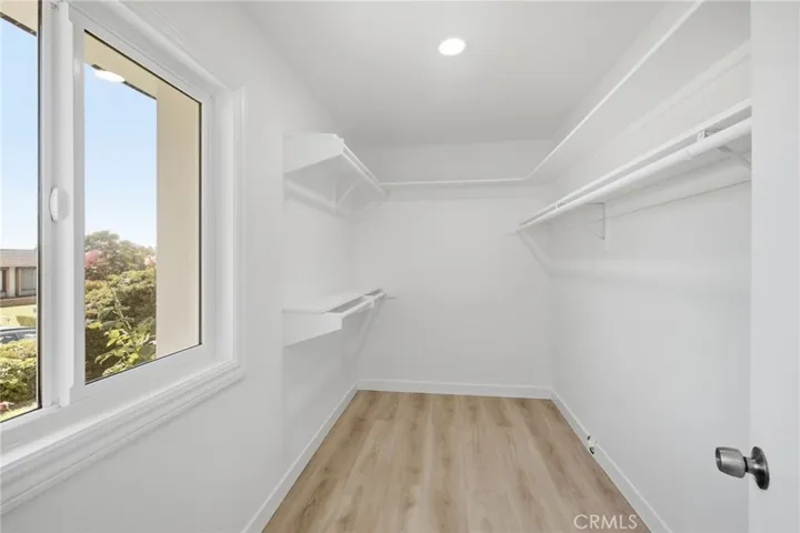 Walk-in closet in. Primary bedroom