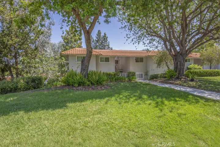 Welcome to 656-O Avenida Sevilla - an upper (nine steps to front door) two-bedroom, two-bath CASTILLA residence in the Laguna Woods senior community. Note the excellent curb appeal and landscaping that is maintained by the Mutual.