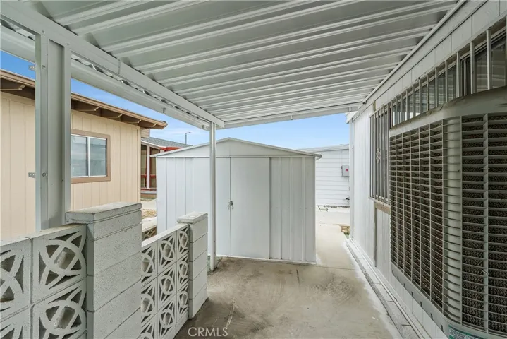 Back side yard with cover and shed.