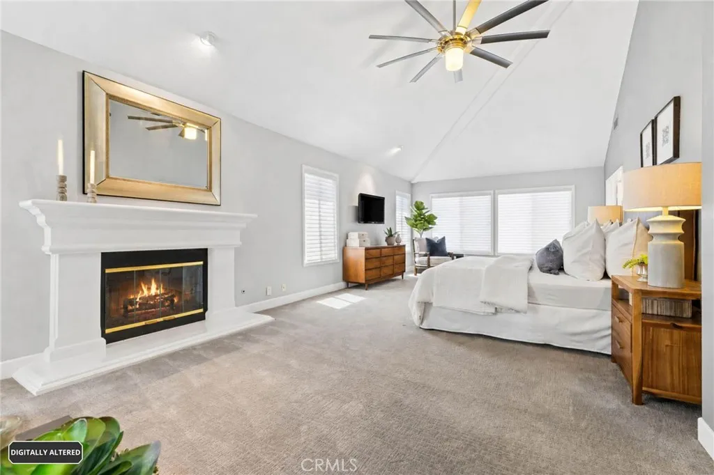 Enormous primary bedroom with cozy fireplace and a retreat
