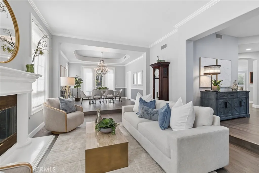 Formal living room and dining room with glass door to the backyard
