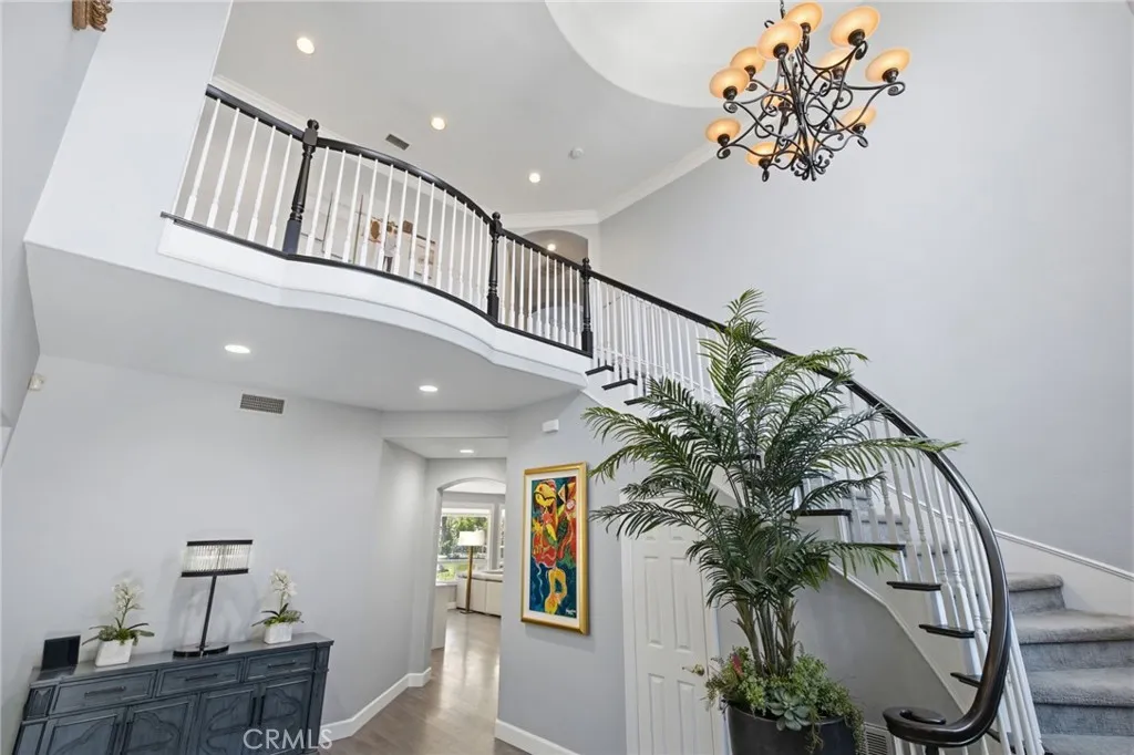 This grand entrance and staircase greet you