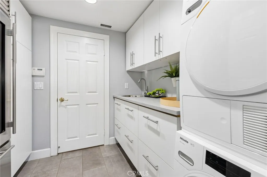 Main floor laundry room with garage access (2nd is upstairs in the primary bathroom)
