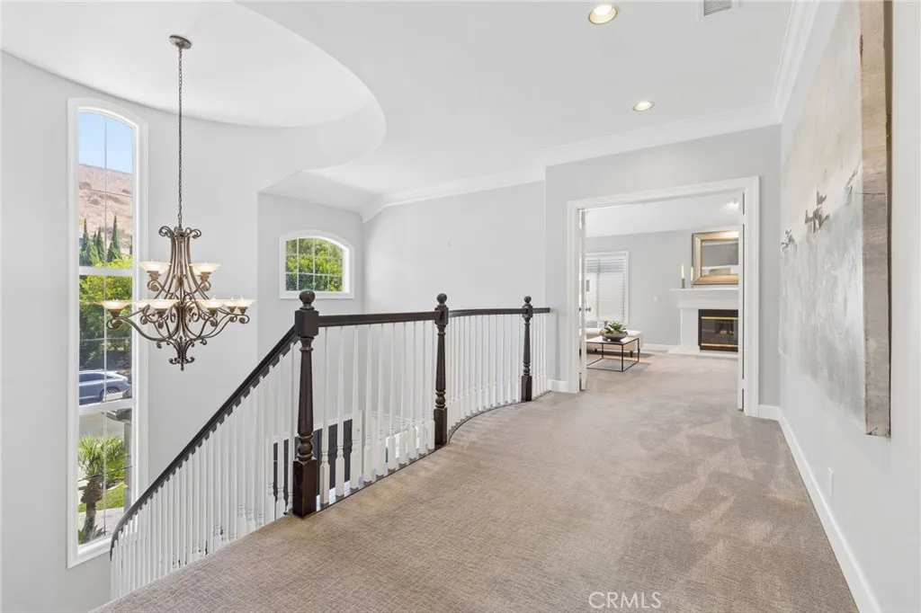 Landing to the grand primary bedroom with retreat