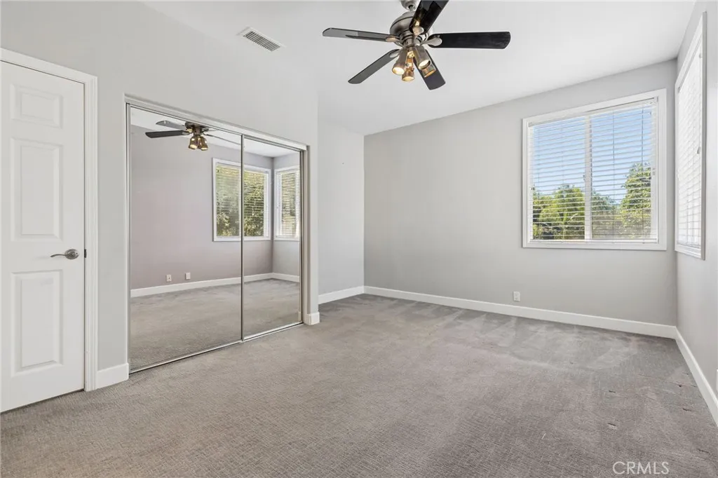 One of the upper bedrooms overlooking the backyard with jack-n-jill access bathroom