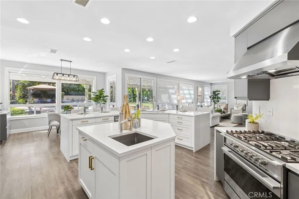 Second kitchen island offering another sink, filtered water station
