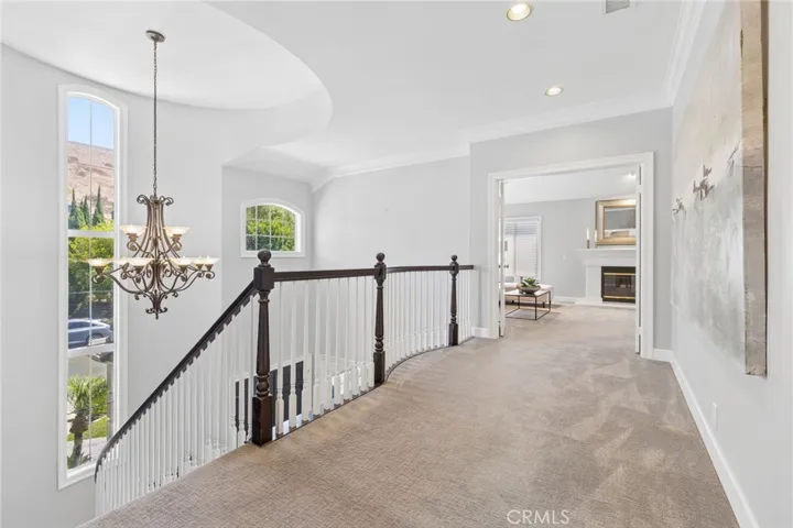 Landing to the grand primary bedroom with retreat