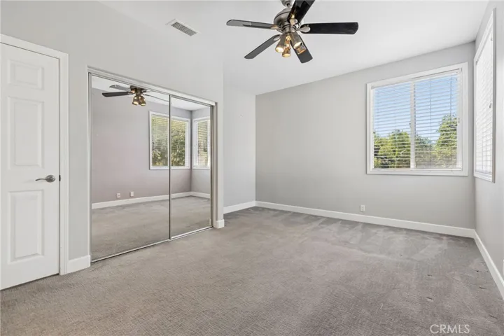 One of the upper bedrooms overlooking the backyard with jack-n-jill access bathroom