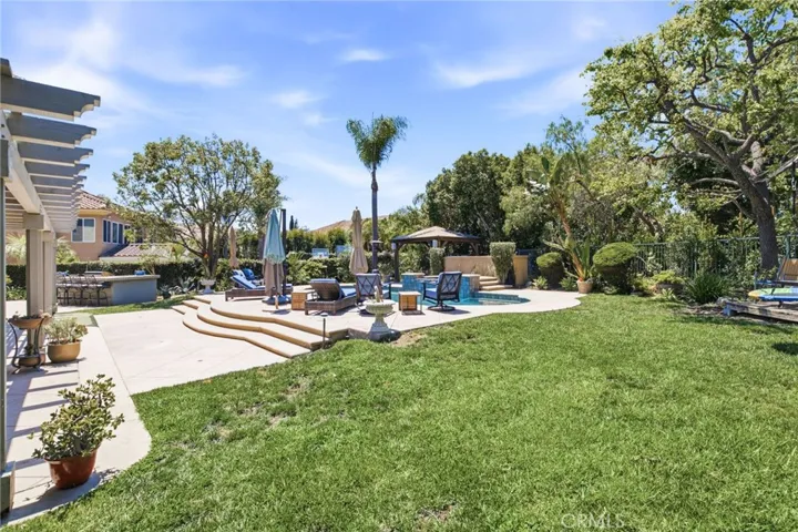 Expansive backyard with plenty of seating areas and grass