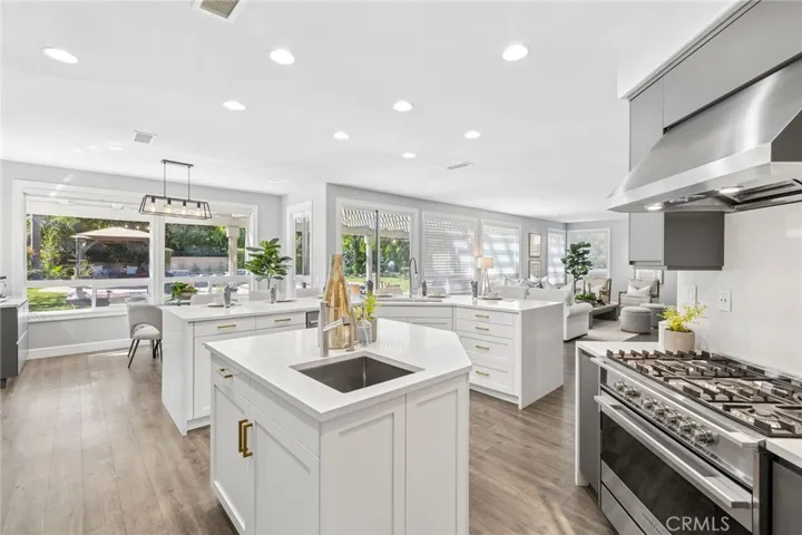 Second kitchen island offering another sink, filtered water station