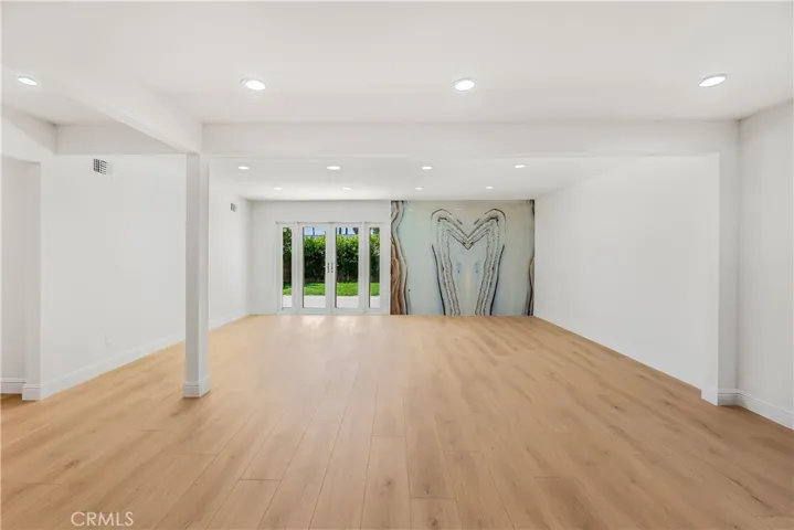 DINING AND LIVING ROOM WITH ACCESS TO THE ENTERTAINERS BACK YARD