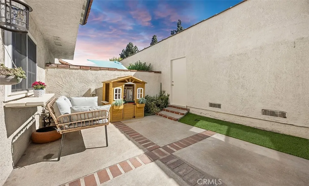 Rear courtyard with direct access to garage. Rear courtyard with direct access to garage.