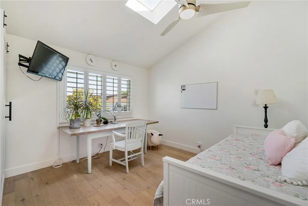 1st guest bedroom including vaulted ceiling, skylight, ceiling fan and light and plantation shutters. 1st guest bedroom including vaulted ceiling, skylight, ceiling fan and light and plantation shutters.