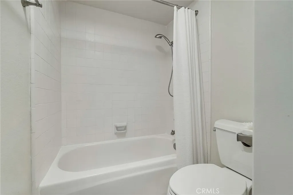 Upstairs bathroom private toilet area and shower in tub. Upstairs bathroom private toilet area and shower in tub.