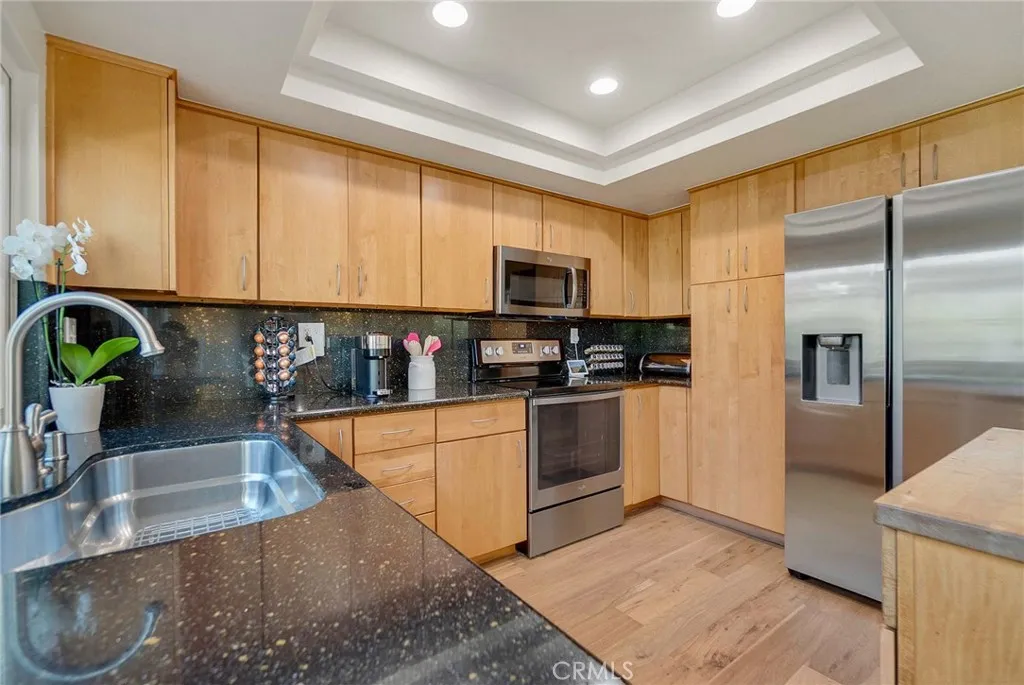 Kitchen with plenty of storage and granite counters. Kitchen with plenty of storage and granite counters.