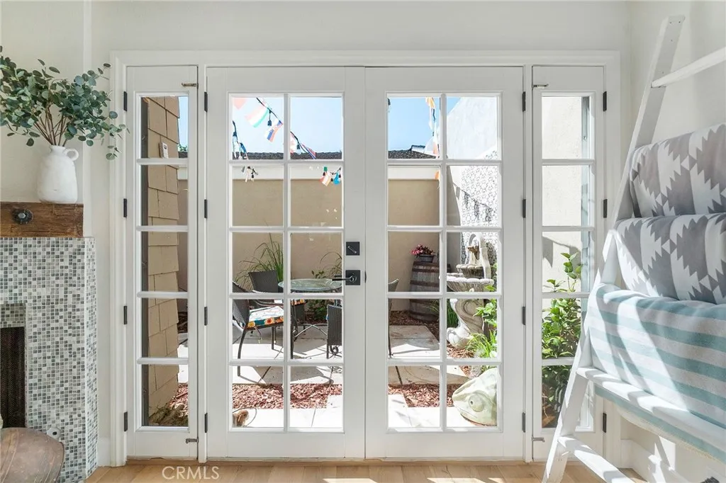 French dual pane doors into front patio. French dual pane doors into front patio.