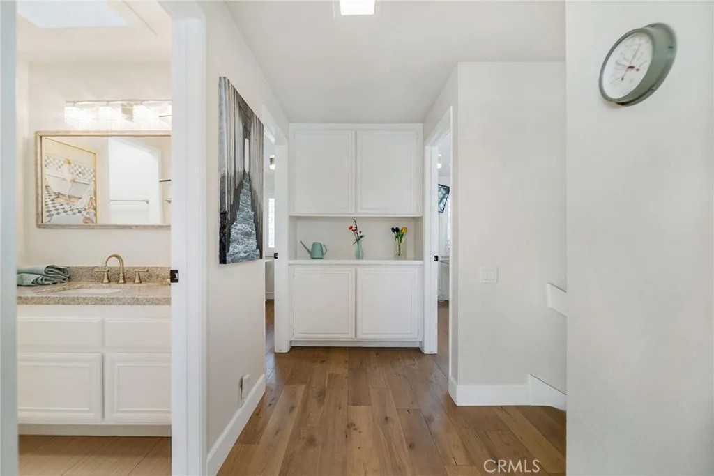 Upstairs hallway including entry to full bath and linen cabinet space area. Upstairs hallway including entry to full bath and linen cabinet space area.